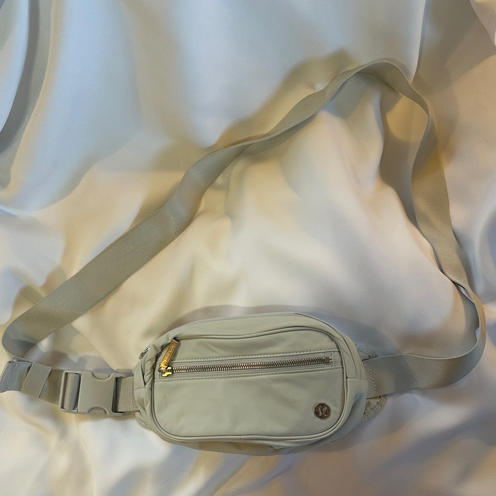 Light Gray Lululemon Belt Bag with Gold Accents